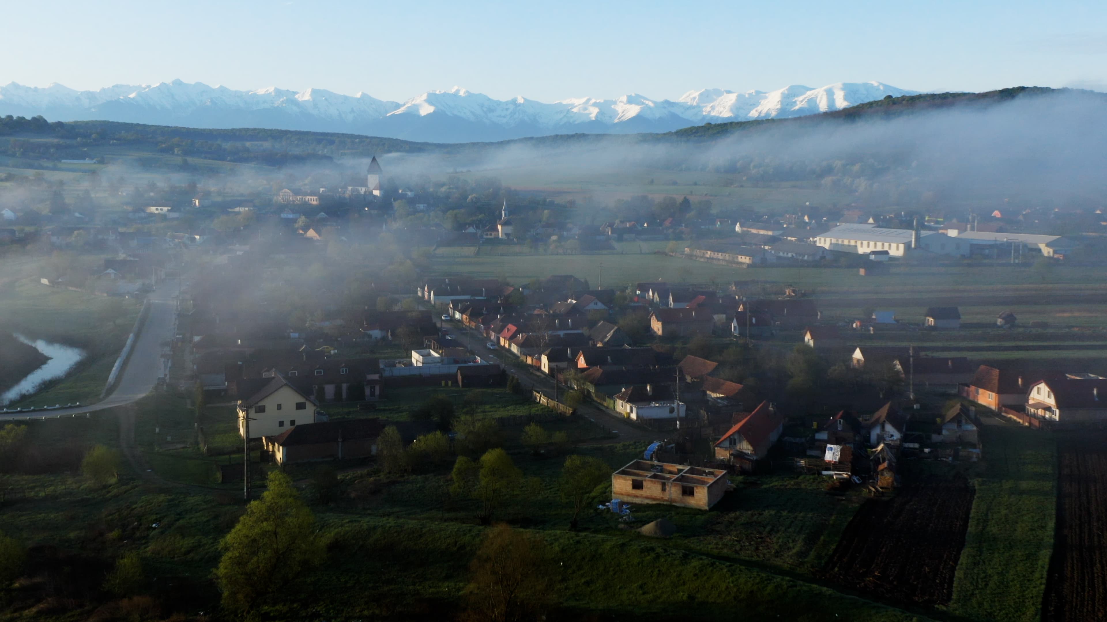 Morning mist over a Transylvanian village